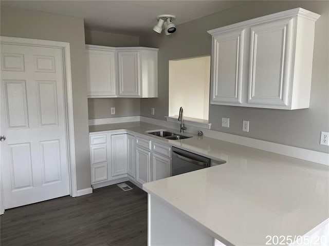 14 Mandy Ct, Troy, MO 63379 - kitchen with a sink, dishwasher, light countertops, white cabinets, and a peninsula