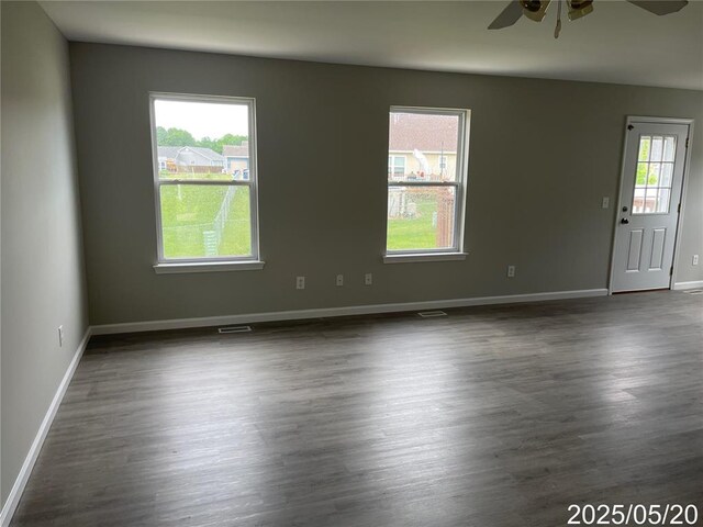 14 Mandy Ct, Troy, MO 63379 - spare room featuring ceiling fan, plenty of natural light, dark wood-type flooring, and baseboards