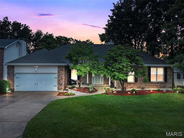 15 Eagles Way Ln, Lake St Louis, MO 63367 - view of front facade featuring driveway, an attached garage, a lawn, brick siding, and a shingled roof