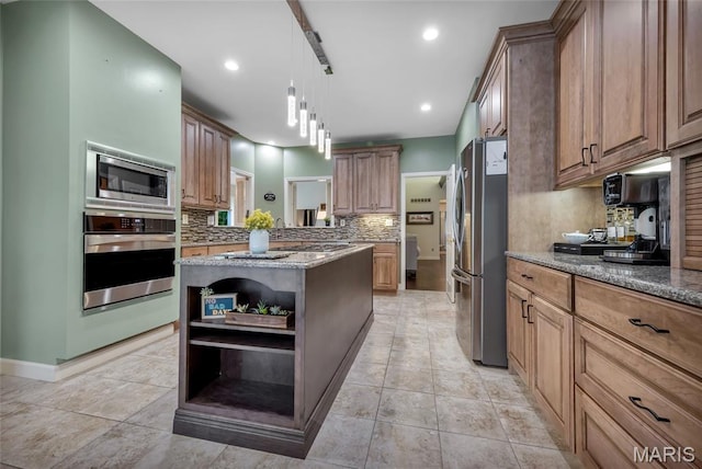 15 Eagles Way Ln, Lake St Louis, MO 63367 - kitchen featuring stainless steel appliances, open shelves, backsplash, light stone counters, and a kitchen island