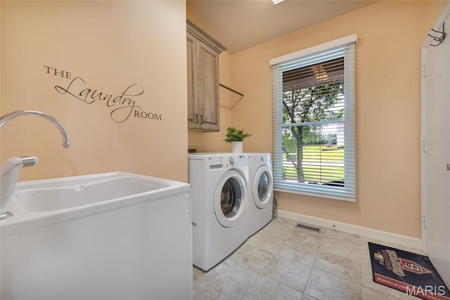 15 Eagles Way Ln, Lake St Louis, MO 63367 - washroom with cabinet space, washer and dryer, and light tile patterned flooring