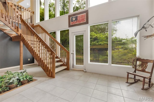 15 Eagles Way Ln, Lake St Louis, MO 63367 - tiled foyer entrance featuring healthy amount of natural light and stairway