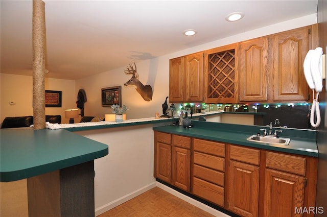 15 Eagles Way Ln, Lake St Louis, MO 63367 - kitchen with brown cabinets, recessed lighting, open floor plan, and a peninsula