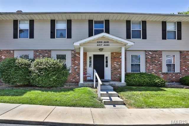 2223 Highland Hill Drive E, Saint Peters, MO 63376 - multi unit property with brick siding and a front lawn