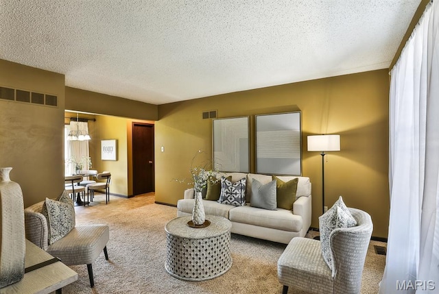 2223 Highland Hill Drive E, Saint Peters, MO 63376 - living room with carpet floors, a textured ceiling, and a chandelier