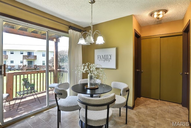 2223 Highland Hill Drive E, Saint Peters, MO 63376 - tiled dining room with a chandelier and a textured ceiling