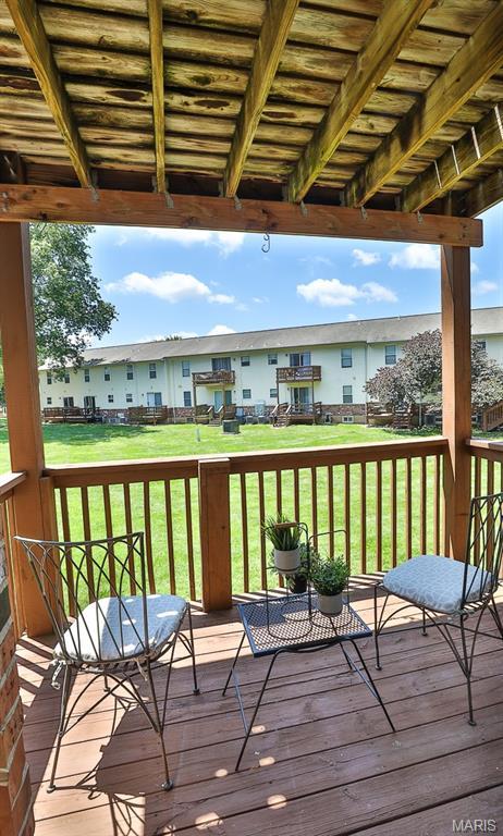 2223 Highland Hill Drive E, Saint Peters, MO 63376 - wooden deck with a residential view and a yard