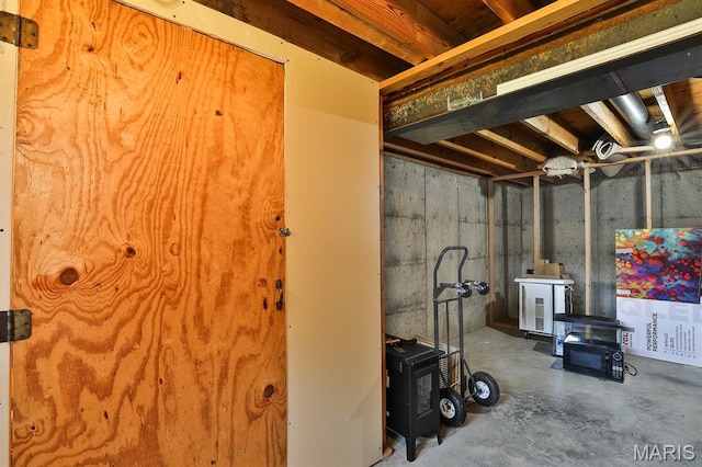 2223 Highland Hill Drive E, Saint Peters, MO 63376 - below grade area with a wood stove