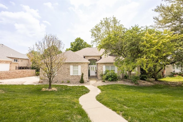 3 Wedgewood Ct, Edwardsville, IL 62025 - french provincial home with a front yard, brick siding, and roof with shingles