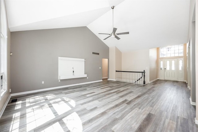 3 Wedgewood Ct, Edwardsville, IL 62025 - unfurnished living room with high vaulted ceiling, ceiling fan, wood finished floors, and baseboards