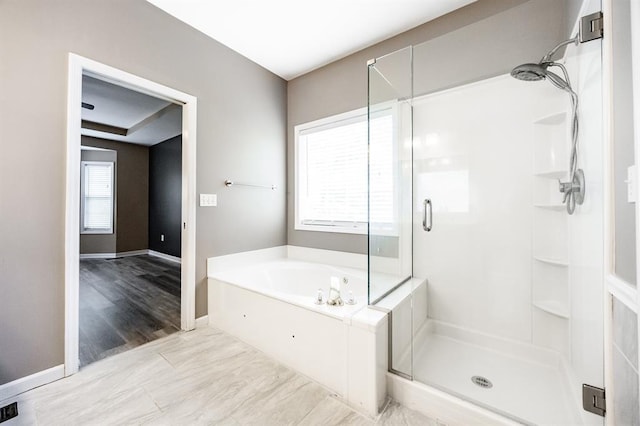 3 Wedgewood Ct, Edwardsville, IL 62025 - bathroom featuring a stall shower, a bath, and baseboards