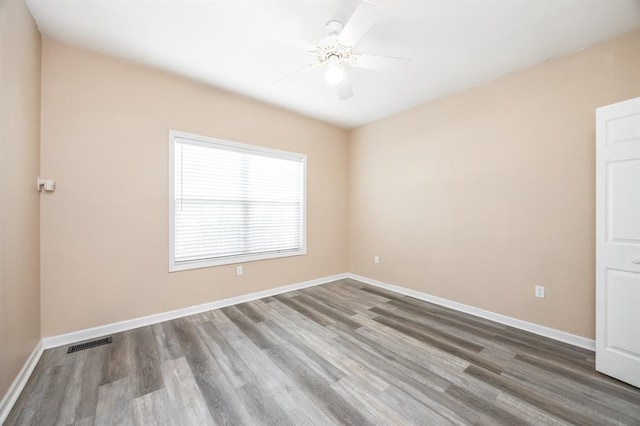 3 Wedgewood Ct, Edwardsville, IL 62025 - spare room featuring wood finished floors, a ceiling fan, and baseboards