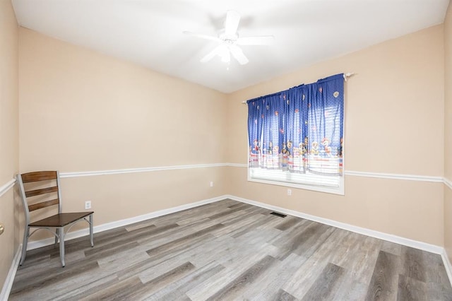 3 Wedgewood Ct, Edwardsville, IL 62025 - empty room with wood finished floors, ceiling fan, and baseboards