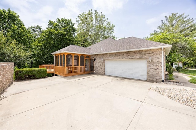 3 Wedgewood Ct, Edwardsville, IL 62025 - view of front of house with brick siding, an attached garage, concrete driveway, and covered porch