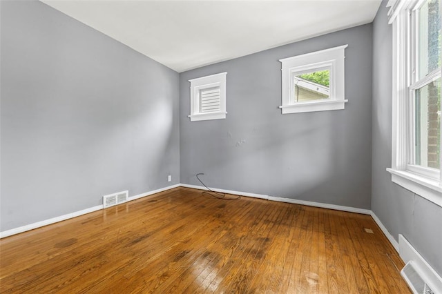 7348 Grand Dr, Pagedale, MO 63133 - spare room with hardwood / wood-style flooring and baseboards
