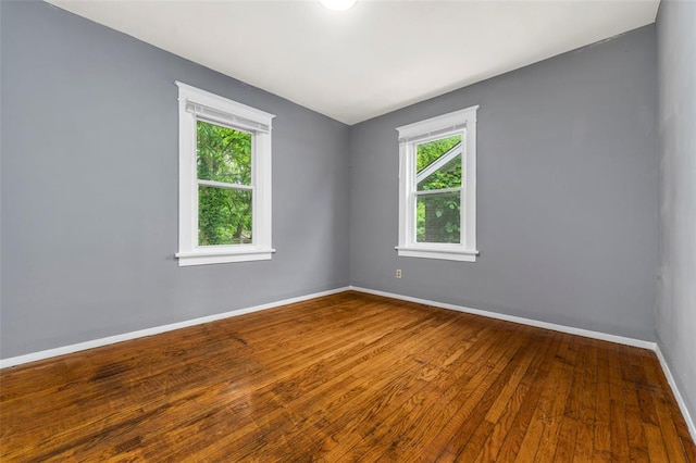 7348 Grand Dr, Pagedale, MO 63133 - empty room with hardwood / wood-style floors and baseboards