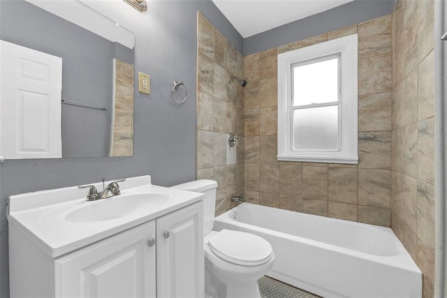 7348 Grand Dr, Pagedale, MO 63133 - bathroom featuring vanity, toilet, and tub / shower combination