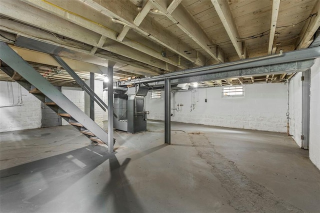 7348 Grand Dr, Pagedale, MO 63133 - basement with stairway and heating unit
