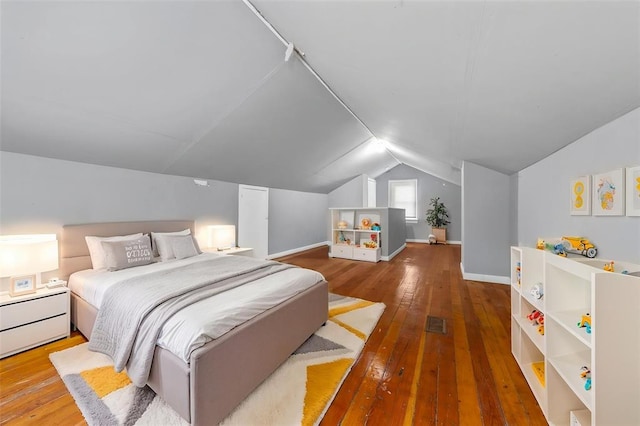 7348 Grand Dr, Pagedale, MO 63133 - bedroom with hardwood / wood-style flooring, lofted ceiling, and baseboards