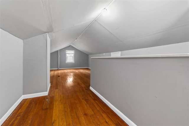 7348 Grand Dr, Pagedale, MO 63133 - bonus room with vaulted ceiling, baseboards, and wood-type flooring