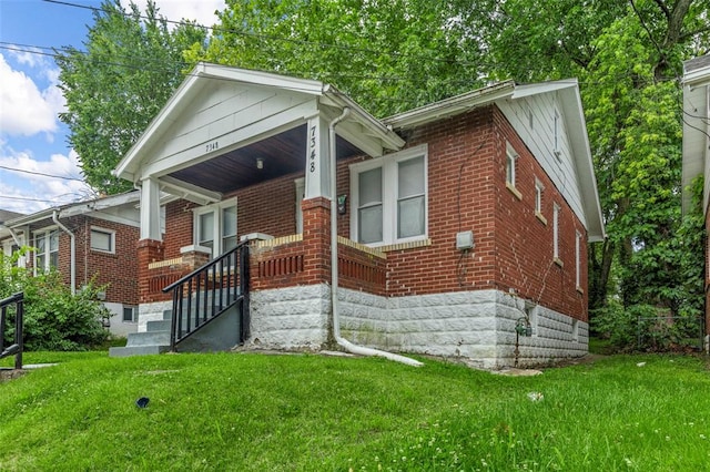7348 Grand Dr, Pagedale, MO 63133 - view of front of property featuring brick siding and a front yard