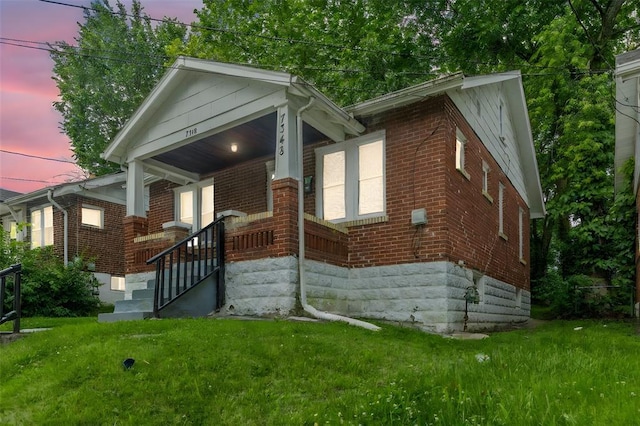 7348 Grand Dr, Pagedale, MO 63133 - view of front of home featuring brick siding and a front yard