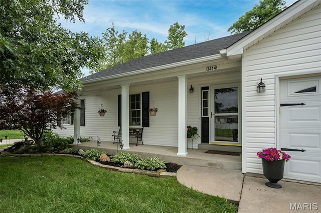 3414 Bedford Falls Dr, Wentzville, MO 63385 - view of exterior entry featuring covered porch, a shingled roof, and a yard