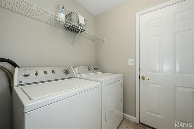 3414 Bedford Falls Dr, Wentzville, MO 63385 - laundry room featuring separate washer and dryer and baseboards