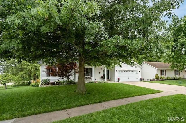 3414 Bedford Falls Dr, Wentzville, MO 63385 - view of property hidden behind natural elements with driveway, a front lawn, and a garage