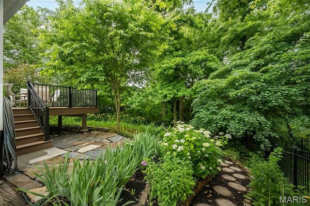 3414 Bedford Falls Dr, Wentzville, MO 63385 - view of yard featuring a deck and stairs
