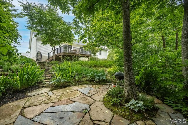 3414 Bedford Falls Dr, Wentzville, MO 63385 - view of yard featuring stairs and a wooden deck