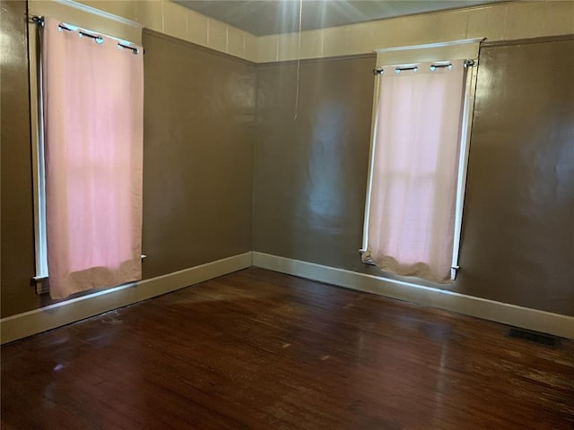 201 3rd St, Chaffee, MO 63740 - unfurnished room with wood finished floors and baseboards