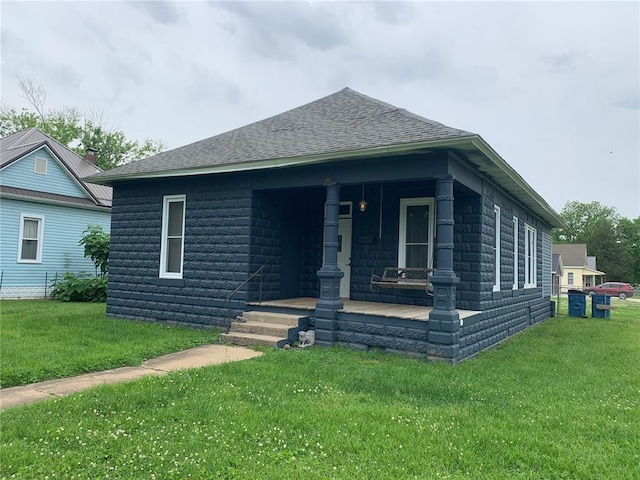 201 3rd St, Chaffee, MO 63740 - view of front of house featuring a porch, a front yard, and a shingled roof