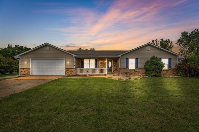 1111 Bluffview Dr, Desloge, MO 63628 - ranch-style house with driveway, a porch, a garage, brick siding, and a lawn