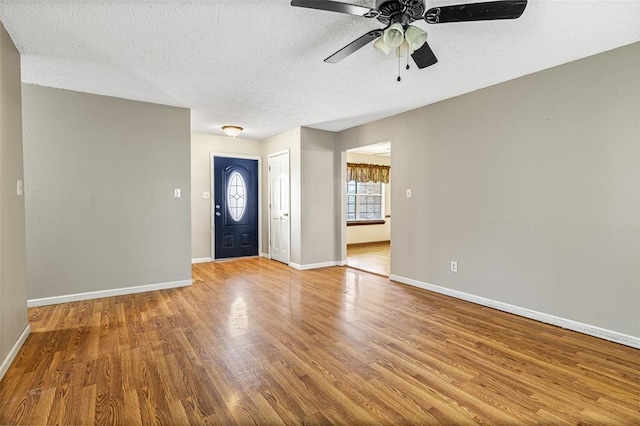 1111 Bluffview Dr, Desloge, MO 63628 - entrance foyer featuring ceiling fan, wood finished floors, baseboards, and a textured ceiling