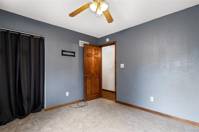 1111 Bluffview Dr, Desloge, MO 63628 - unfurnished bedroom with carpet, baseboards, and ceiling fan