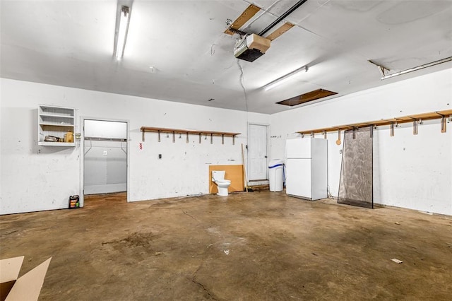1111 Bluffview Dr, Desloge, MO 63628 - garage with freestanding refrigerator and a garage door opener