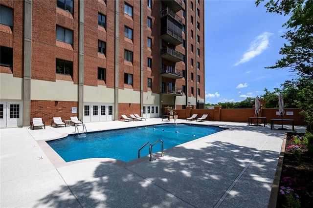 816 S Hanley Rd Unit 8C, Saint Louis, MO 63105 - community pool with a patio area and french doors