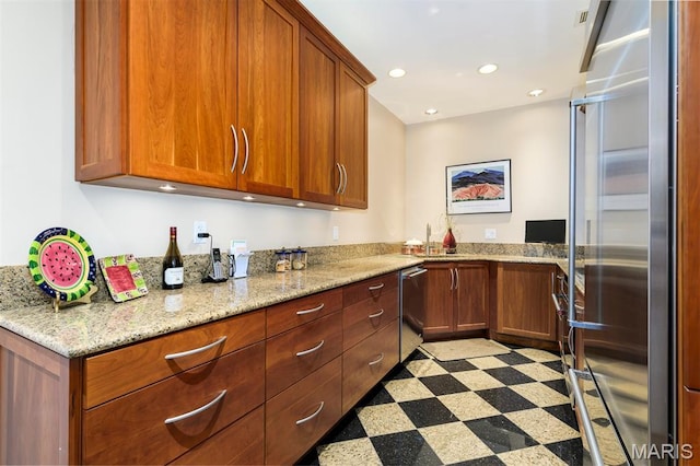 816 S Hanley Rd Unit 8C, Saint Louis, MO 63105 - kitchen featuring appliances with stainless steel finishes, light floors, and brown cabinets