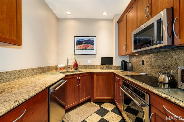 816 S Hanley Rd Unit 8C, Saint Louis, MO 63105 - kitchen featuring stainless steel appliances, light stone countertops, light floors, backsplash, and recessed lighting