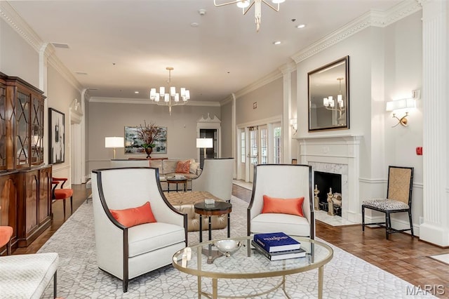 816 S Hanley Rd Unit 8C, Saint Louis, MO 63105 - living area featuring a chandelier, crown molding, a high end fireplace, and ornate columns