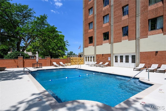 816 S Hanley Rd Unit 8C, Saint Louis, MO 63105 - community pool with a patio area and french doors