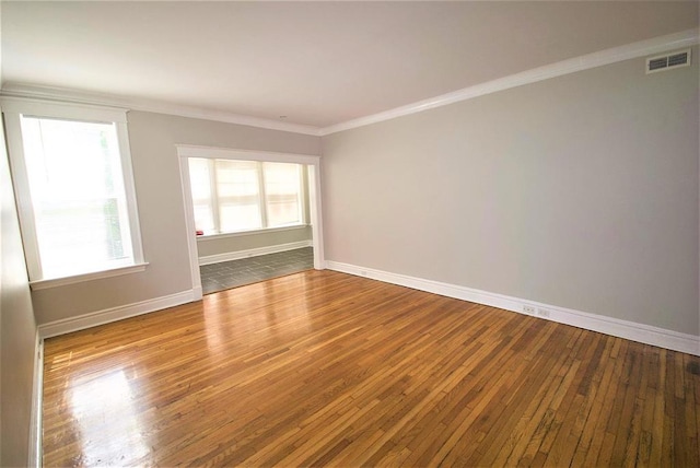 701 Limit Ave, University City, MO 63130 - empty room featuring ornamental molding, hardwood / wood-style flooring, baseboards, and plenty of natural light