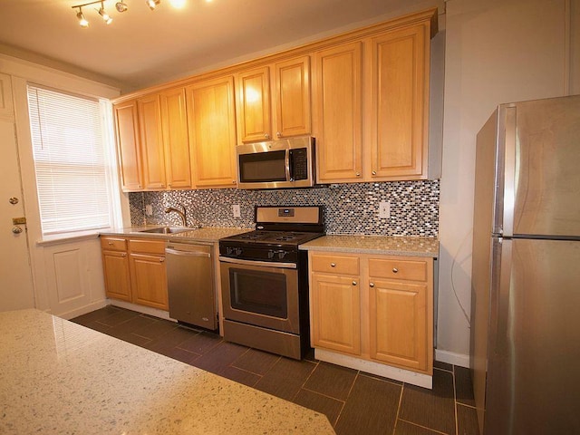 701 Limit Ave, University City, MO 63130 - kitchen with stainless steel appliances, a sink, and tasteful backsplash