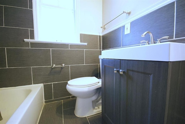 701 Limit Ave, University City, MO 63130 - bathroom with vanity, toilet, tile patterned flooring, tile walls, and a bath