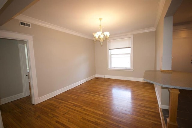 701 Limit Ave, University City, MO 63130 - unfurnished dining area featuring wood finished floors, a chandelier, baseboards, and crown molding