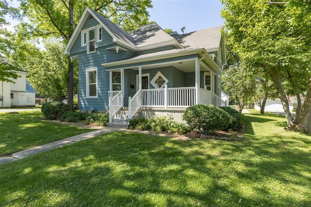 305 W 1st St, Farmington, MO 63640 - view of front of property with a porch and a front lawn