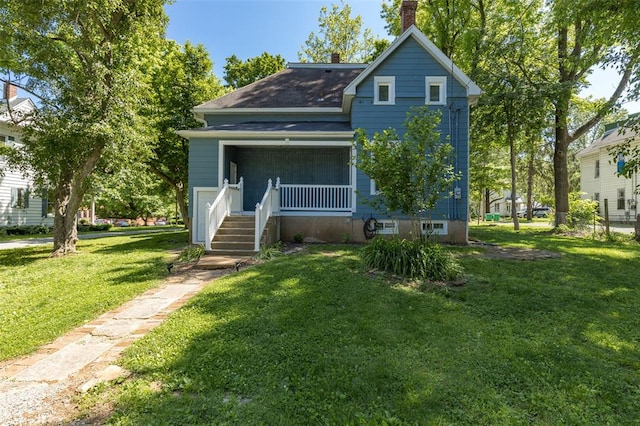 305 W 1st St, Farmington, MO 63640 - view of front of property featuring a front yard, a chimney, and roof with shingles