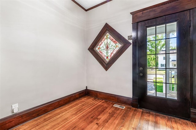 305 W 1st St, Farmington, MO 63640 - entrance foyer with hardwood / wood-style flooring, baseboards, and ornamental molding