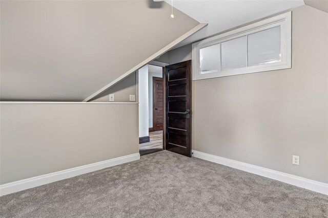 305 W 1st St, Farmington, MO 63640 - additional living space with lofted ceiling, carpet flooring, and baseboards